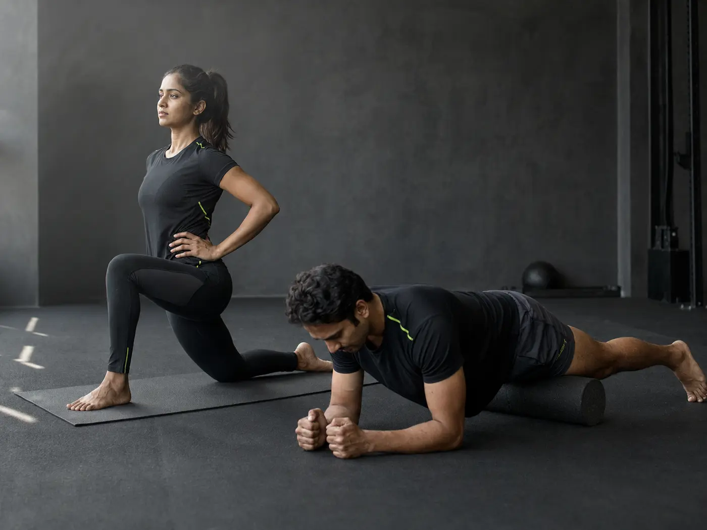 Athletes performing post-workout mobility work